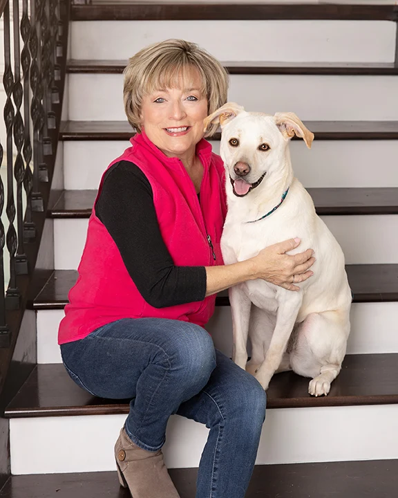 Nancy Brown, owner of Hot Diggity Dog, with a golden retriever